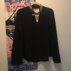 Trendy black top with bedazzled choker detail